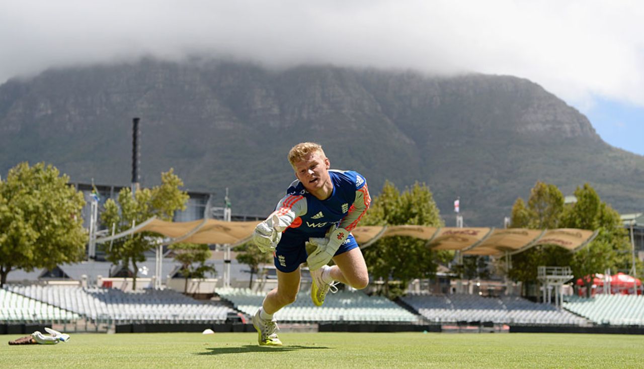Sam Billings works on his keeping with the tablecloth over the mountain, Cape Town, February 16, 2016