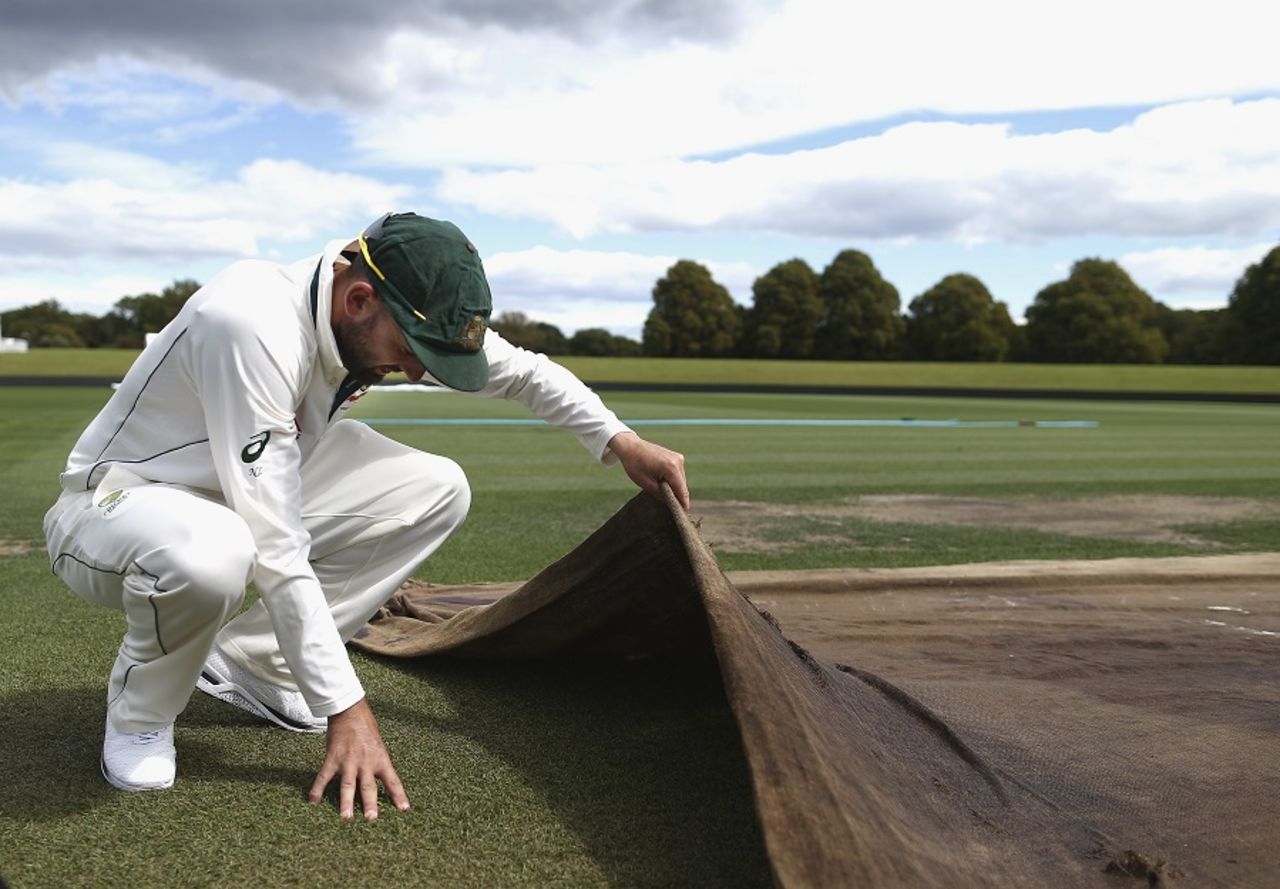 What have you got: Nathan Lyon inspects the Christchurch pitch, Christchurch, February 18, 2016