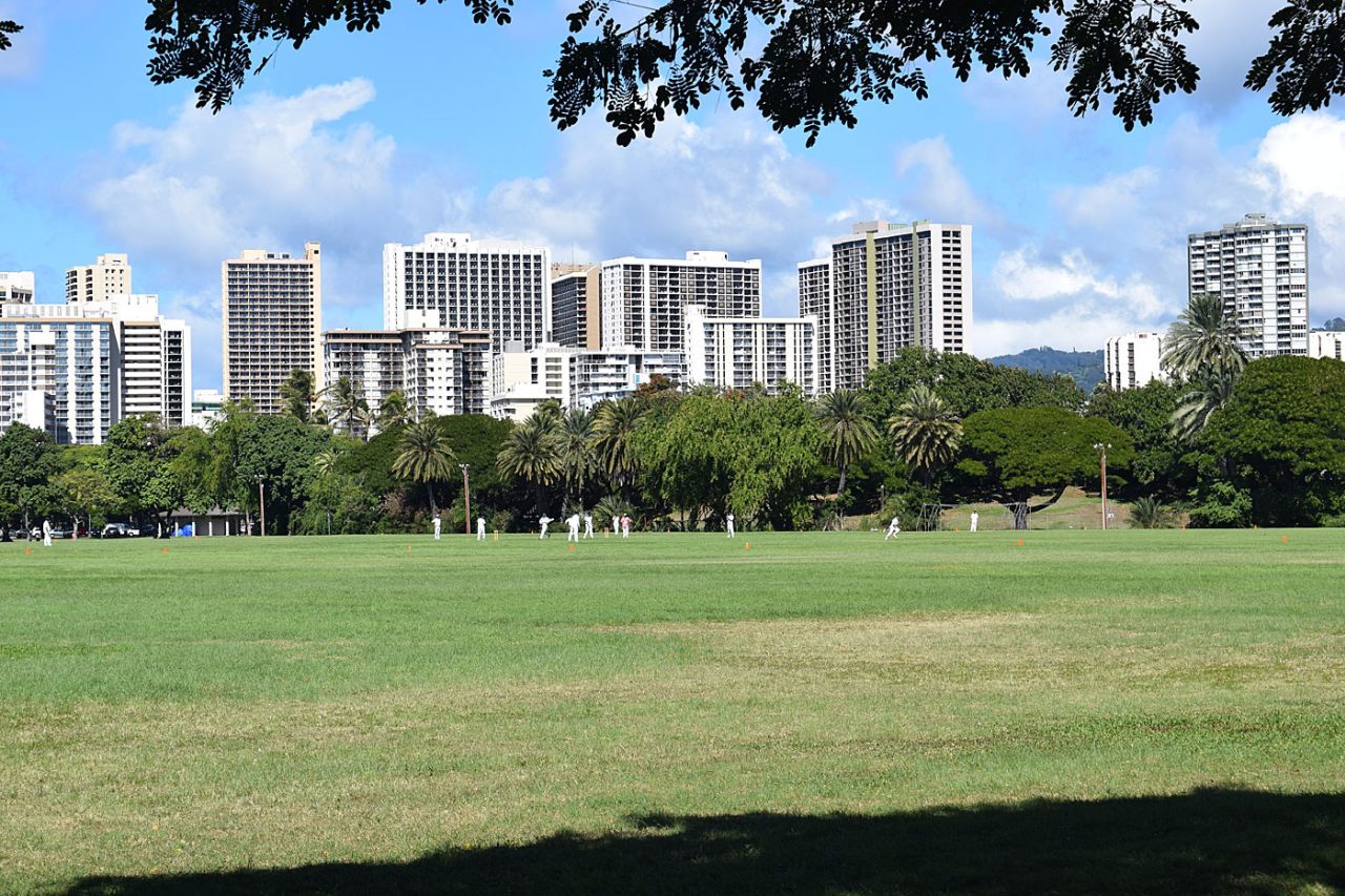 A cricket match in Kapiolani Park in Honolulu with the Waikiki skyline as the backdrop, Hawaii, January 31, 2016