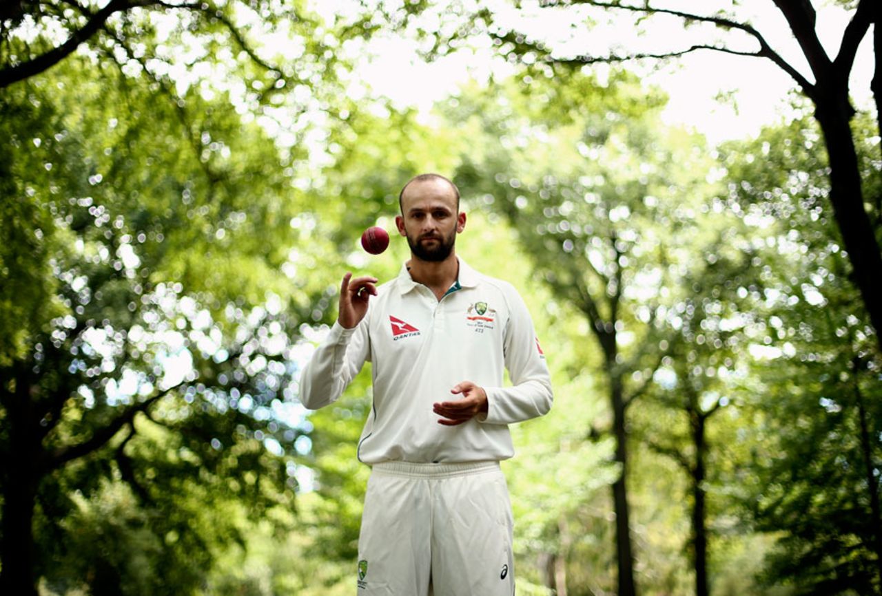 Nathan Lyon tosses one up amid Hagley Park's greenery, Christchurch, February 18, 2016