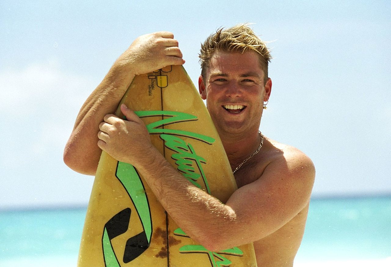 Shane Warne poses with a surfboard in the West Indies, April 1995