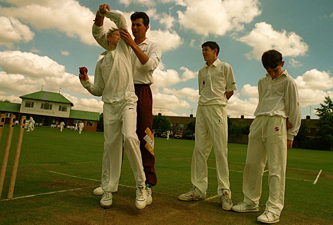 Neil Foster coaches young boys on fast bowling in Northampton, July 30, 1997