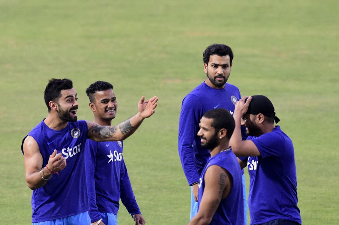 Virat Kohli shares a lighter moment with his team-mates during a training session, Fatullah, February 22, 2016