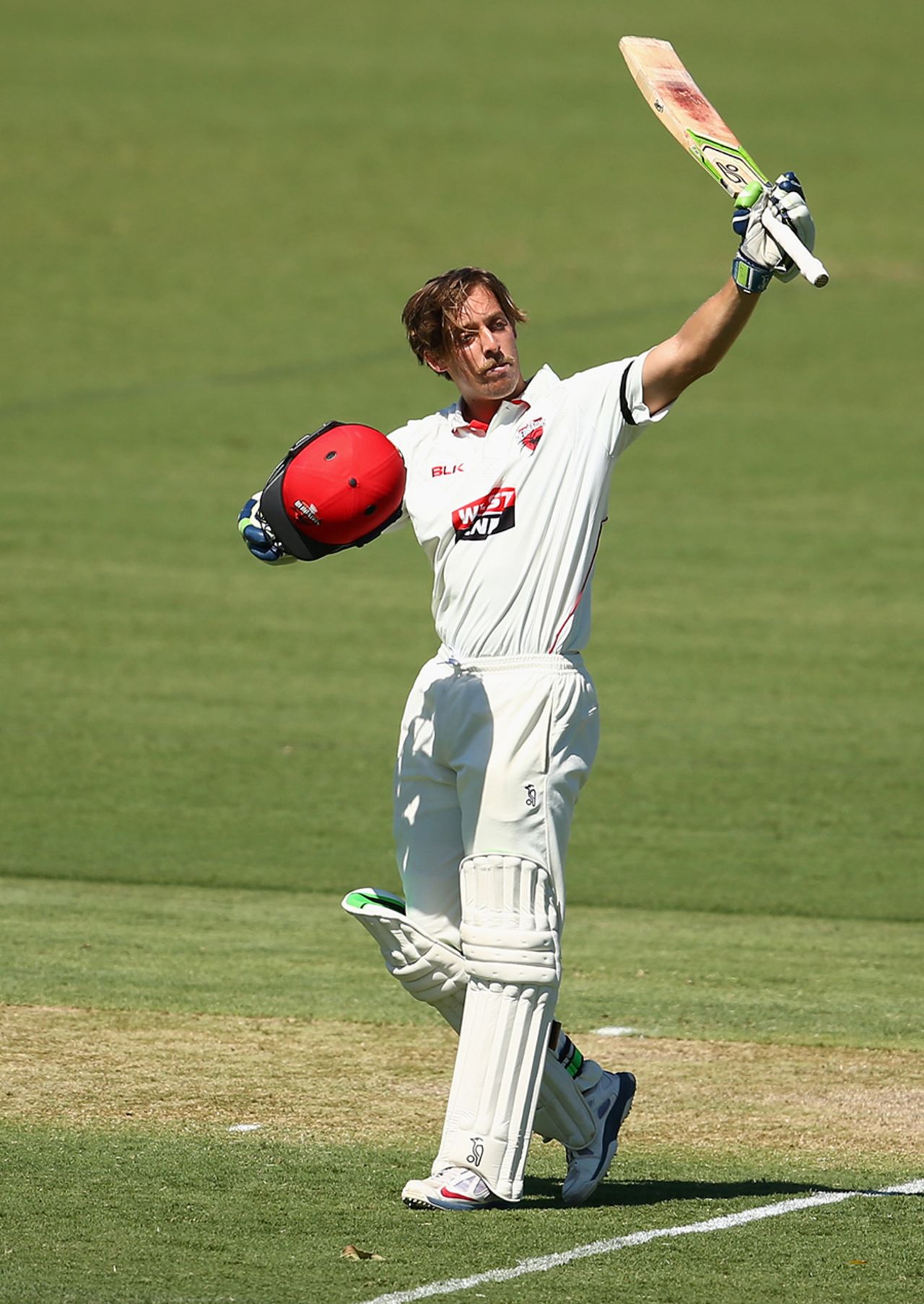 Jake Lehmann raises his bat after scoring his third first-class century, New South Wales v South Australia, Sheffield Shield 2015-16, 1st day, Coff's Harbour, February 25, 2016