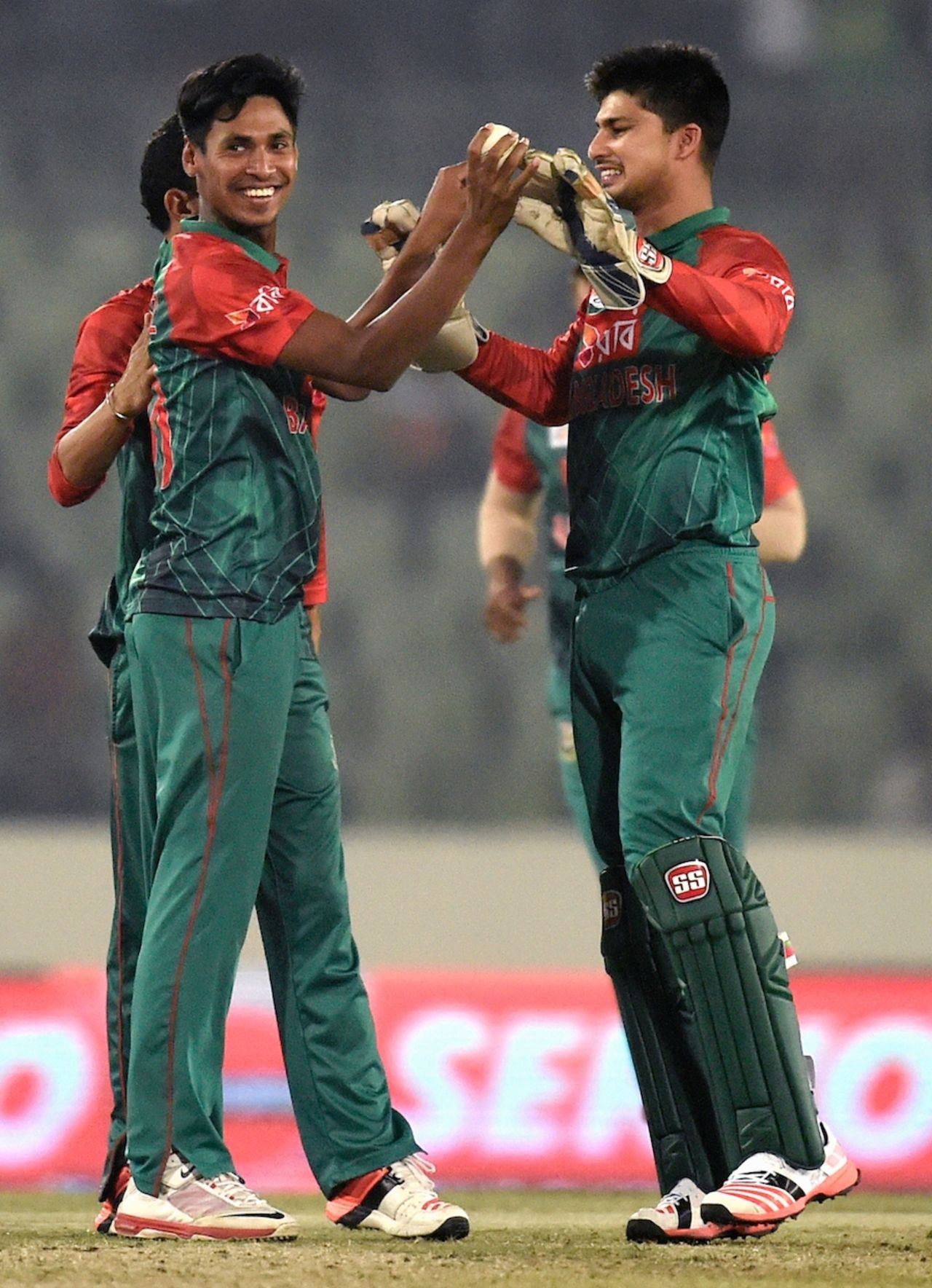 Mustafizur Rahman celebrates one of his two wickets with Nurul Hasan, Bangladesh v UAE, Asia Cup 2016, Mirpur, February 26, 2016