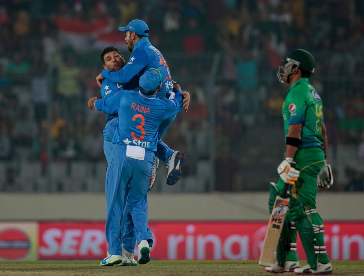 Yuvraj Singh gets more than a hug from Virat Kohli after trapping Umar Akmal, India v Pakistan, Asia Cup, Mirpur, February 27, 2016