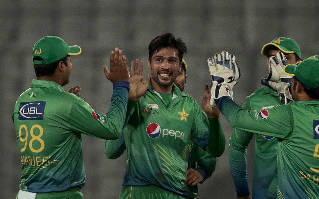 Mohammad Amir is congratulated after knocking over Muhammad Kaleem's off stump, Pakistan v UAE, Asia Cup, Mirpur, February 29, 2016