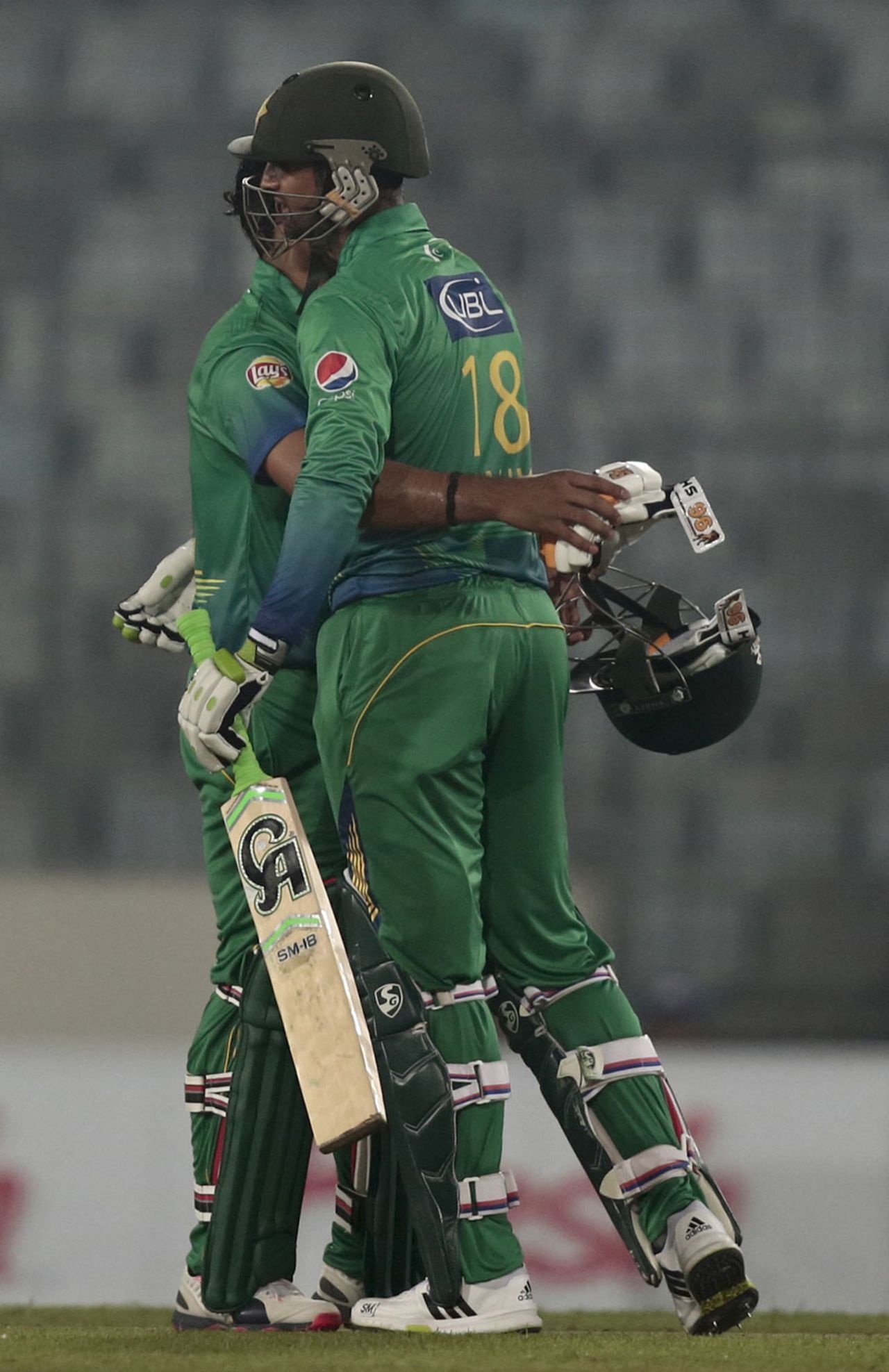 Shoaib Malik and Umar Akmal embrace after Pakistan's win, Pakistan v UAE, Asia Cup, Mirpur, February 29, 2016