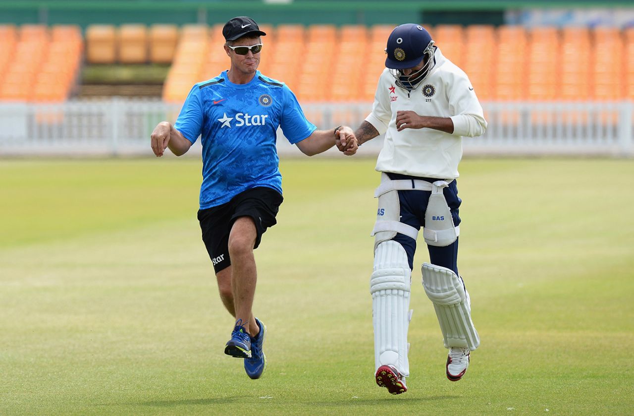 Trevor Penney (left) and Shikhar Dhawan at a warm-up, Grace Road, Leicester, June 25, 2014