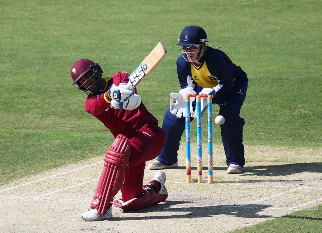 Denesh Ramdin sweeps on his way to a rapid fifty, Warwickshire v West Indies, Dubai, March 4, 2016