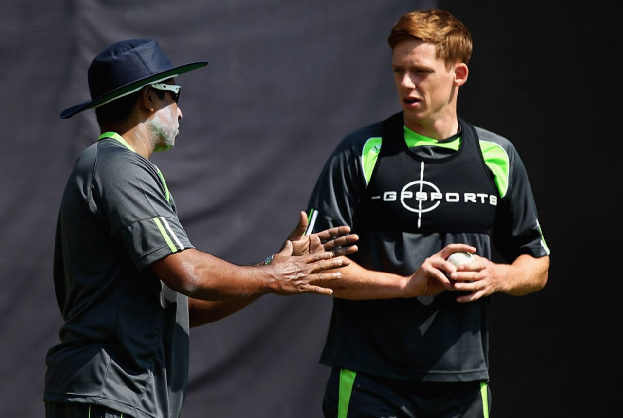 Bowling consultant Chaminda Vaas speaks to Craig Young during a training session, Dharamsala, March 7, 2016