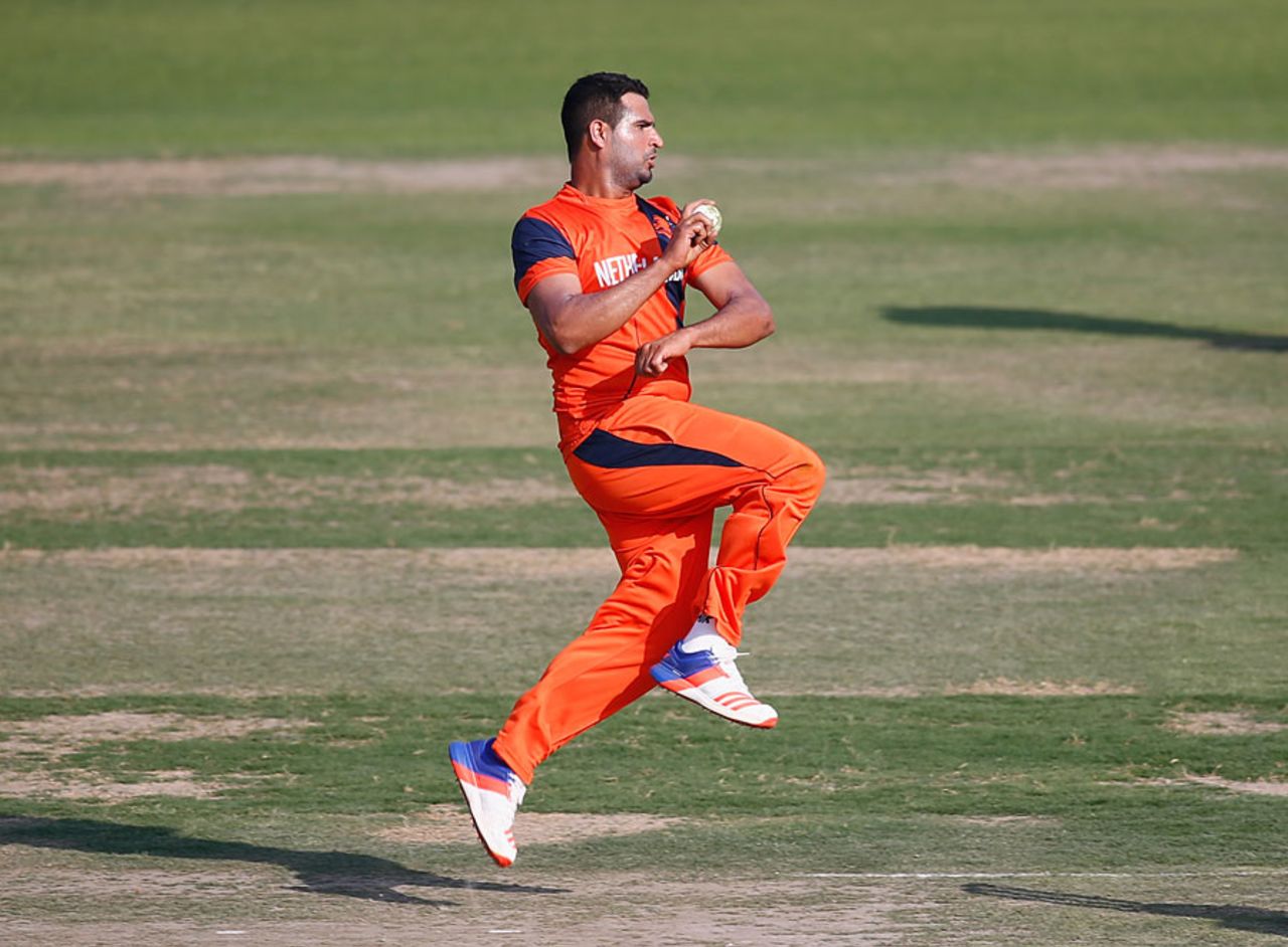 Mudassar Bukhari runs in to bowl, Netherlands v Afghanistan, Warm-up match, Mohali, March 4, 2016