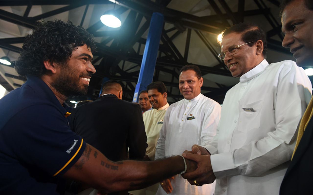 Lasith Malinga shakes hands with Sri Lanka president Maithripala Sirisena in a ceremony prior to Sri Lanka's departure for the World T20, Colombo, March 8, 2016