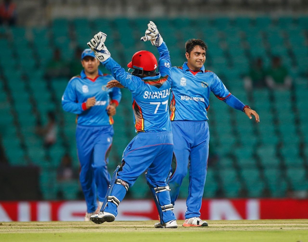 Rashid Khan (R) and Mohammad Shahzad celebrate the wicket of Richie Berrington, Afghanistan v Scotland, World T20 qualifier, Group B, Nagpur, March 8, 2016