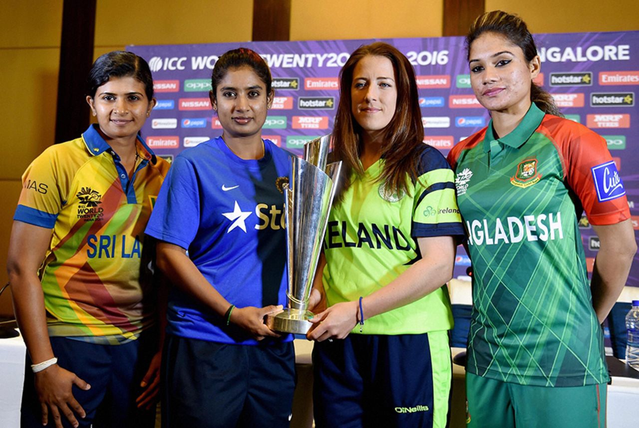 Team captains Shashikala Siriwardene, Mithali Raj, Isobel Joyce and Jahanara Alam pose with the Women's World T20 trophy, Bangalore, March 9, 2016