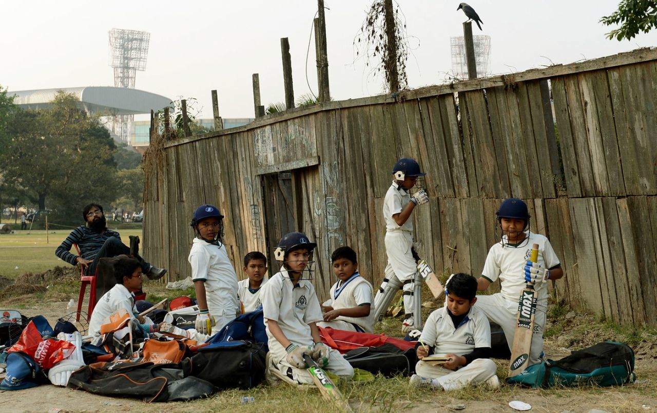 Kids take a break from cricket at the Kolkata Maidan, December 1, 2012