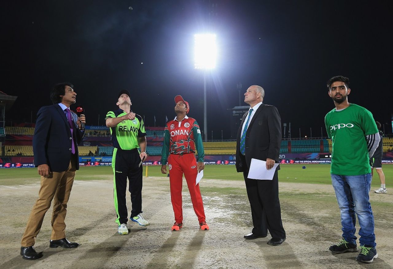 William Porterfield tosses the coin as Sultan Ahmed looks on, Ireland v Oman, World T20 qualifier, Group A, Dharamsala, March 9, 2016