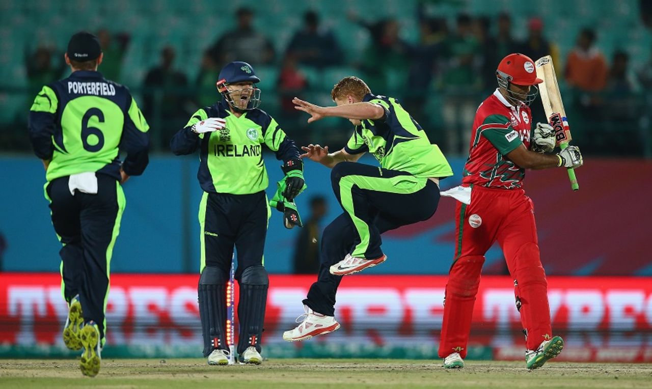 Khawar Ali almost accidentally hits Kevin O'Brien as he expresses his disappointment after being dismissed, Ireland v Oman, World T20 qualifier, Group A, Dharamsala, March 9, 2016