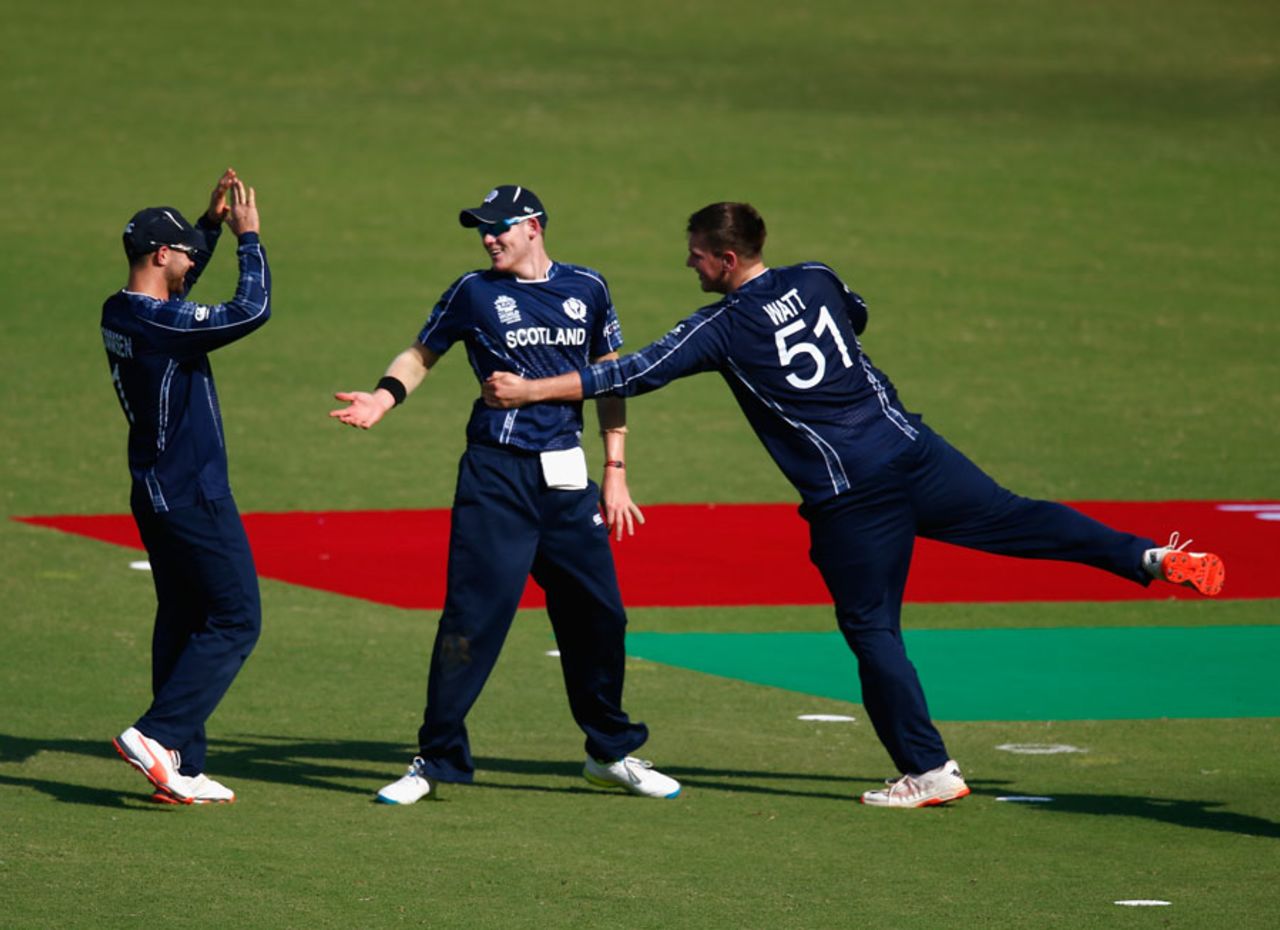 Mark Watt celebrates his wicket with Michael Leask and Preston Mommsen, Scotland v Zimbabwe, Group B, World T20, Nagpur, March 10, 2016
