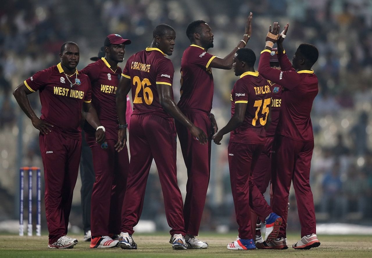 Sulieman Benn is mobbed by his team-mates, India v West Indies, World T20 warm-ups, Kolkata, March 10, 2016
