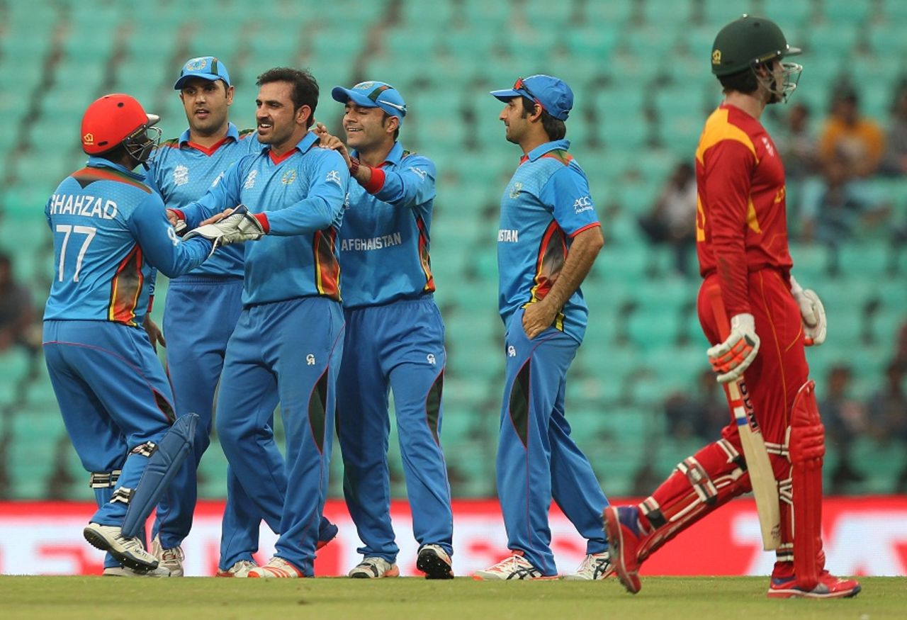 Samiullah Shenwari celebrates Malcolm Waller's wicket with his team-mates, Afghanistan v Zimbabwe, World T20 qualifiers, Group B, Nagpur, March 12, 2016