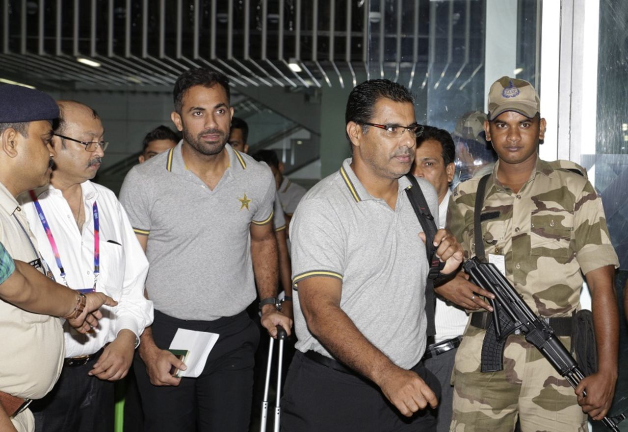 Wahad Riaz and Waqar Younis make their way out of the Kolkata airport, March 12, 2016