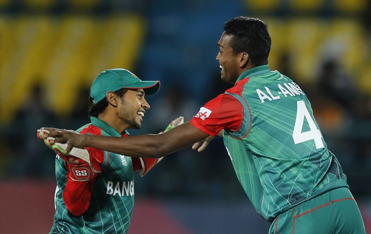 Al-Amin Hossain and Mushfiqur Rahim celebrate a wicket, Bangladesh v Oman, World T20 qualifiers, Group A, Dharamsala, March 13, 2016