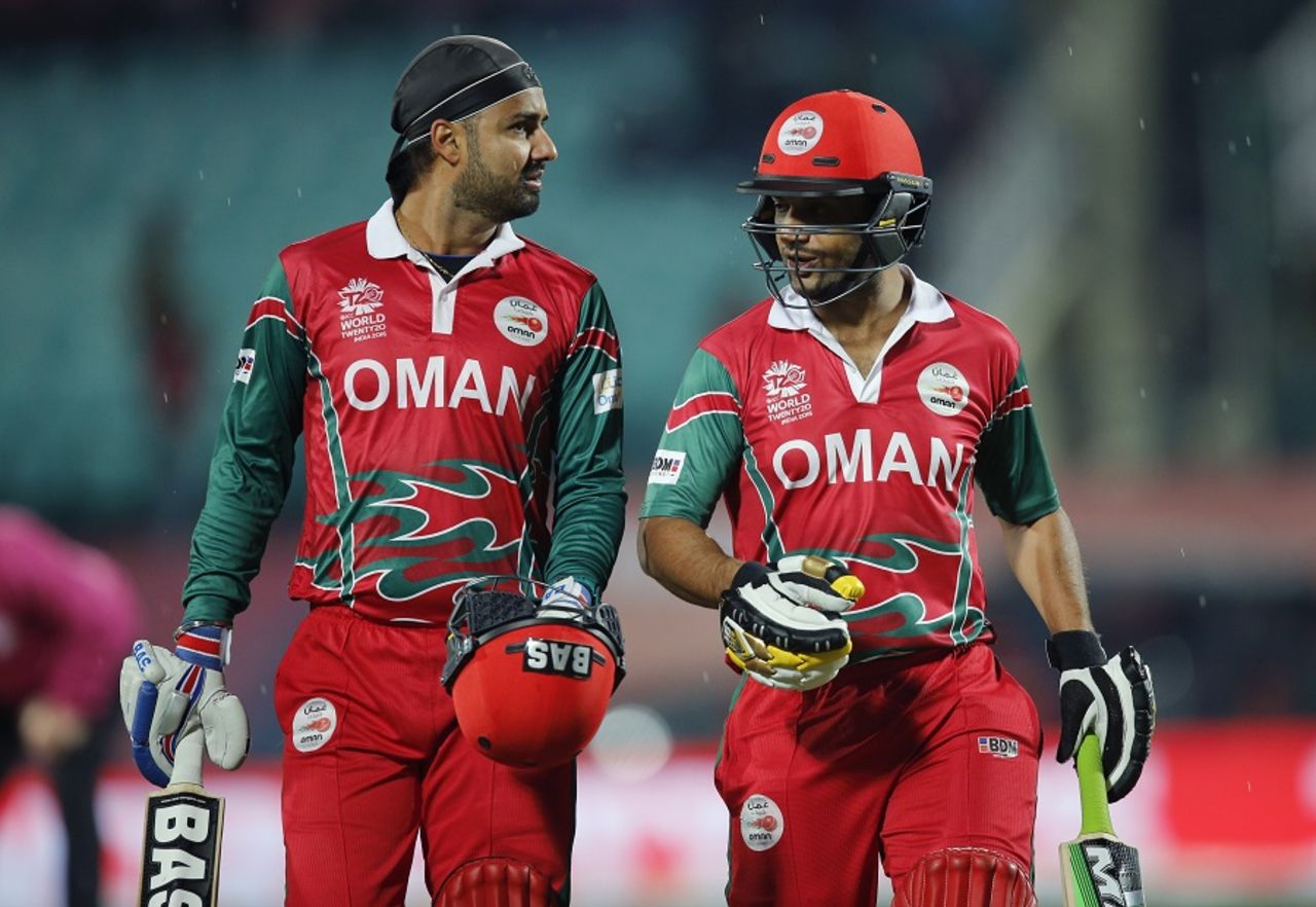 Jatinder Singh and Adnan Ilyas walk off as rain stops play, Bangladesh v Oman, World T20 qualifiers, Group A, Dharamsala, March 13, 2016