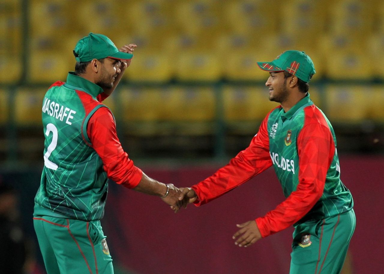 Mashrafe Mortaza and Shakib Al Hasan shake hands after winning the match, Bangladesh v Oman, World T20 qualifiers, Group A, Dharamsala, March 13, 2016