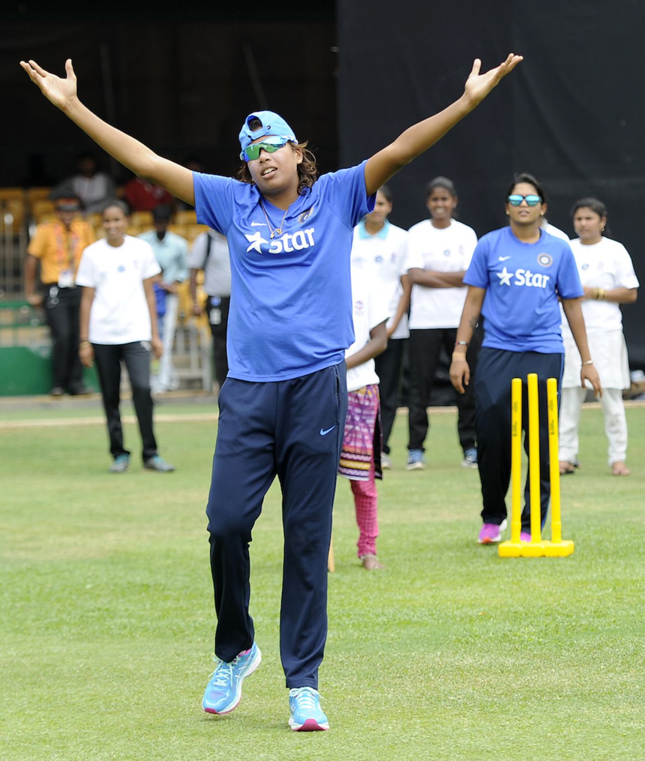Jhulan Goswami reacts while playing with locals, Bangalore, March 14, 2016