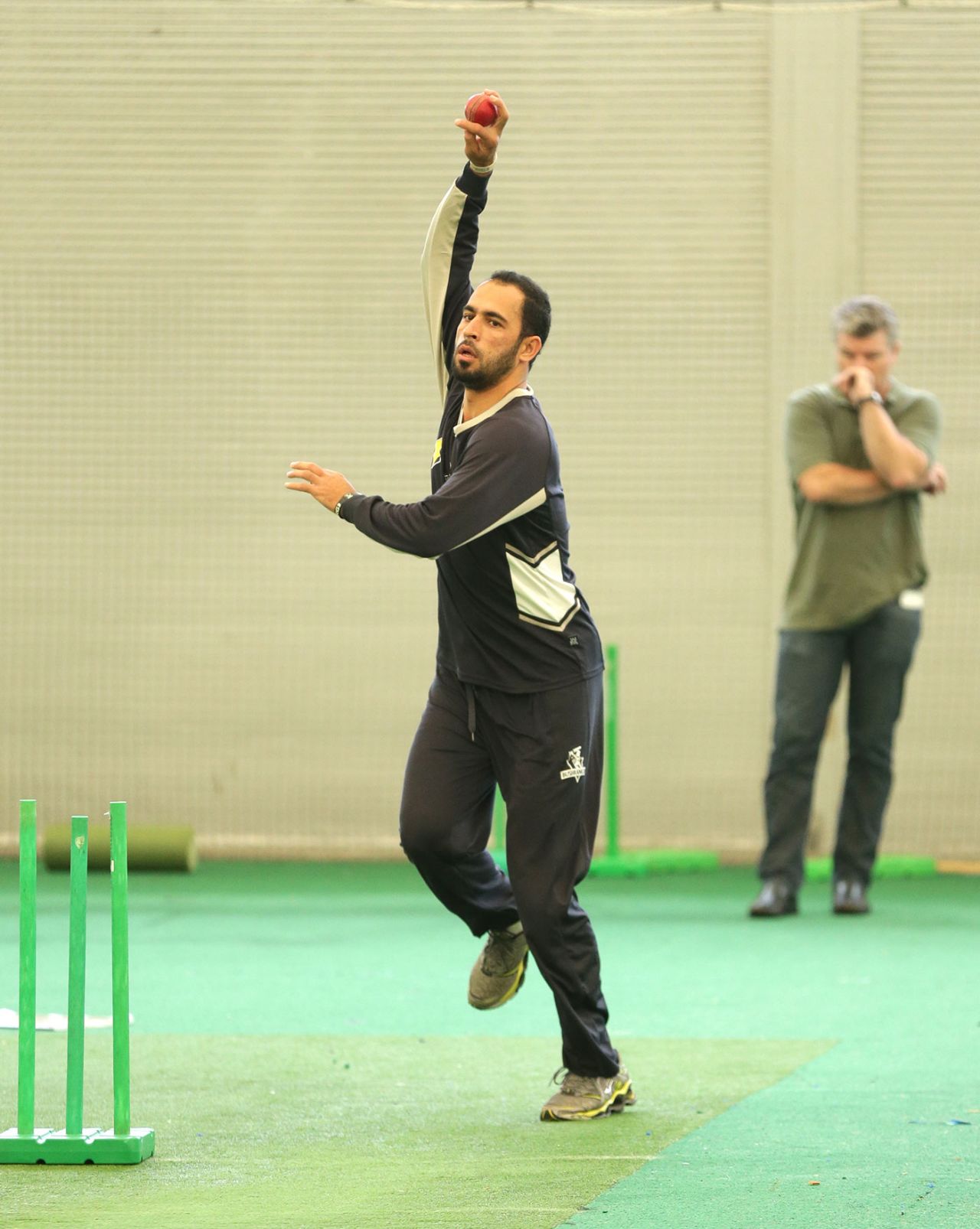 Fawad Ahmed bowls in the nets as Stuart MacGill looks on, Sydney, March 28, 2013