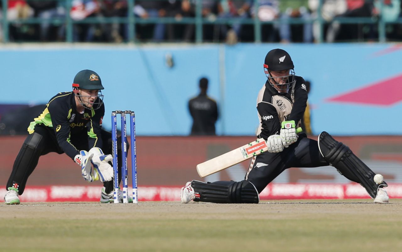 Colin Munro gets low to hit the ball, Australia v New Zealand, World T20 2016, Group 2, Dharamsala, March 18, 2016