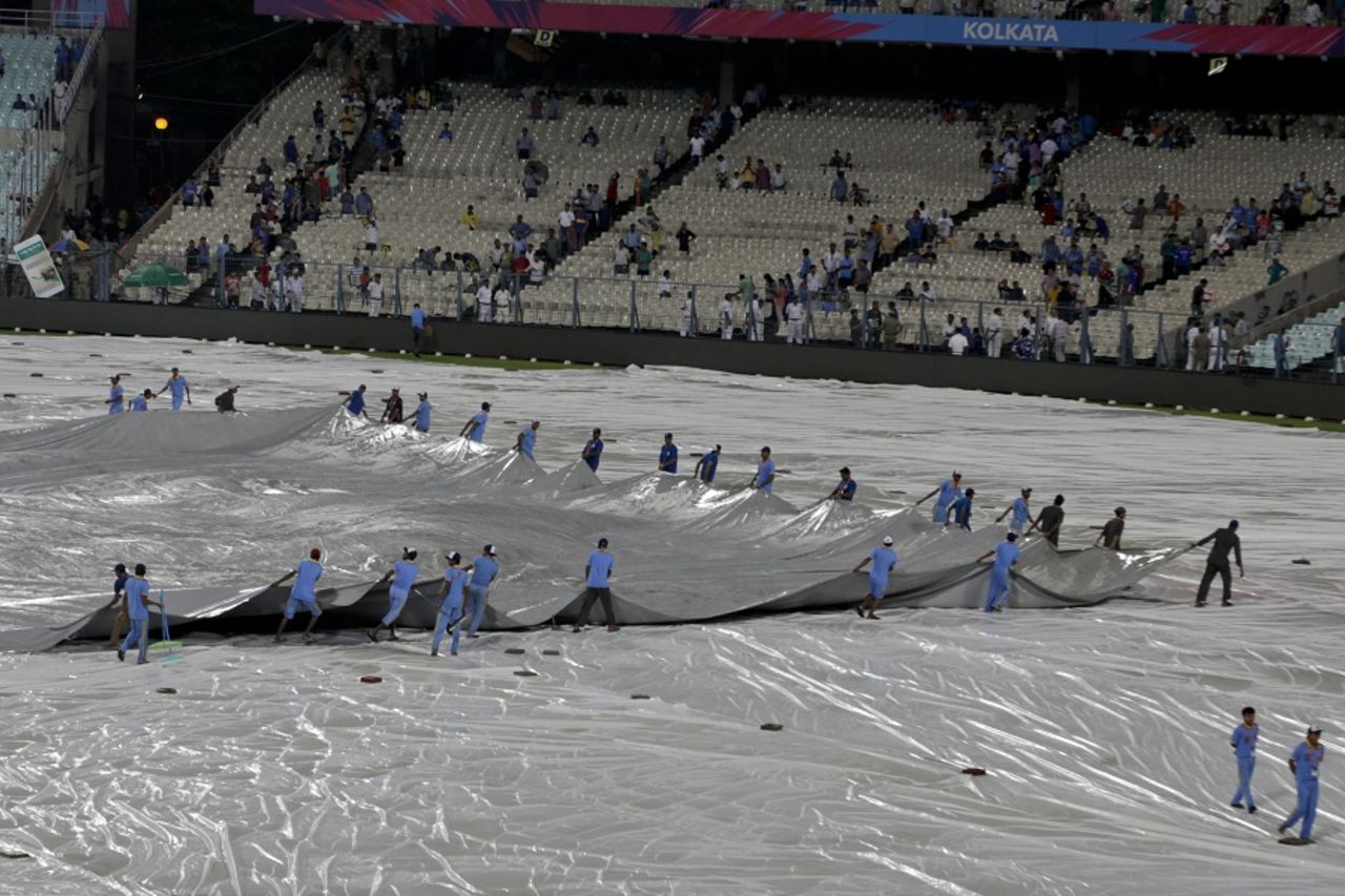 Groundstaff move around the covers on the outfield, India v Pakistan, World T20 2016, Group 2, Kolkata, March 19, 2016