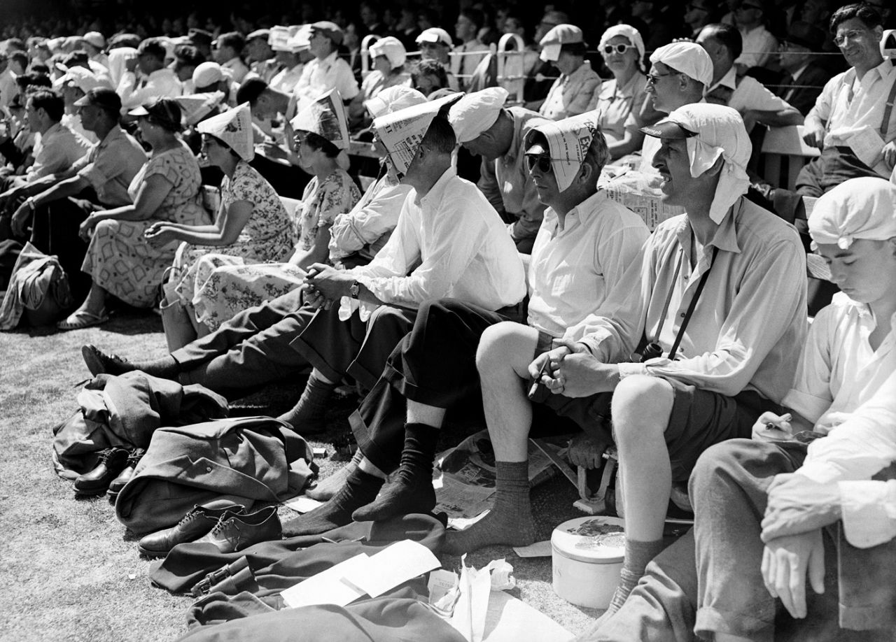 Spectators cover the heads with handkerchiefs and newspaper hats, England v West Indies, 2nd Test Lord's, 1st day, June 20, 1957