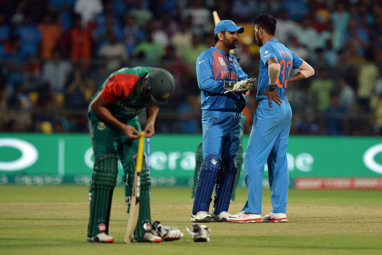 MS Dhoni has a chat with Hardik Pandya during the tense last over, India v Bangladesh, World T20 2016, Group 2, Bangalore, March 23, 2016
