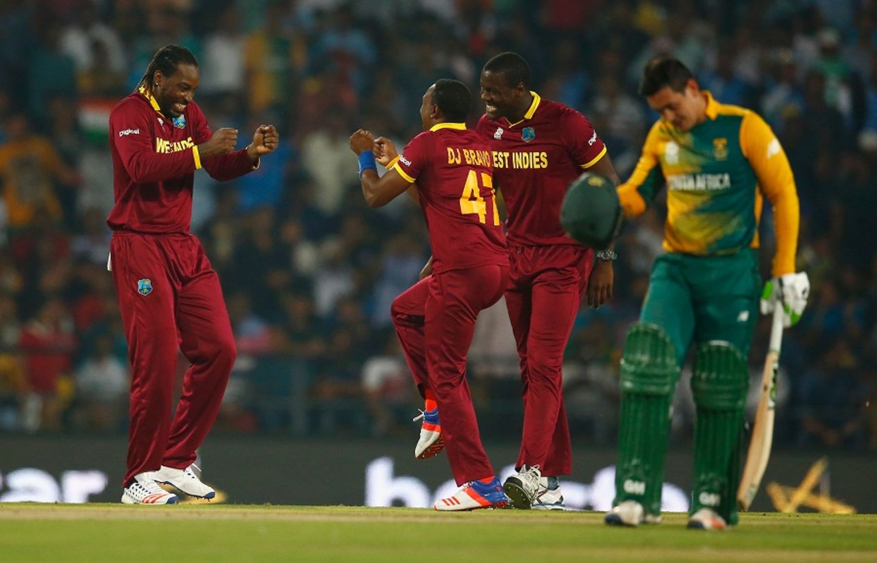 Chris Gayle and Dwayne Bravo celebrate the wicket of Quinton de Kock, South Africa v West Indies, World T20 2016, Group 1, Nagpur, March 25, 2016