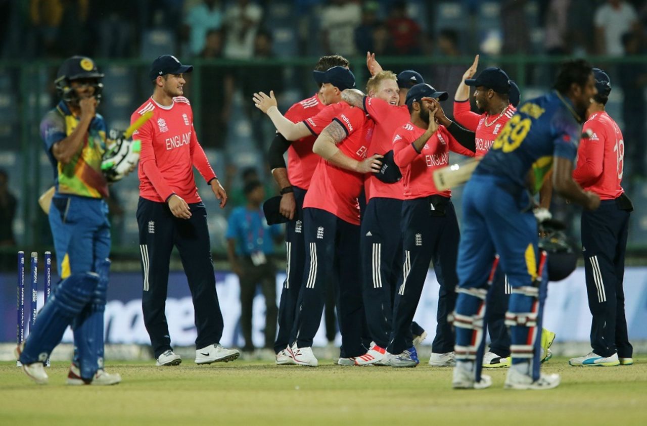 England players celebrate their win while Sri Lanka's players come to terms with their defeat, England v Sri Lanka, World T20 2016, Group 1, Delhi, March 26, 2016