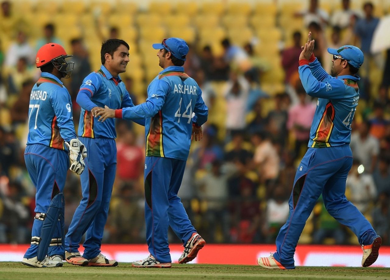 Rashid Khan celebrates one of his two wickets with his team-mates, Afghanistan v West Indies, World T20 2016, Group 1, Nagpur, March 27, 2016