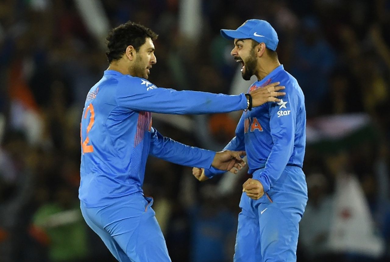 Yuvraj Singh and Virat Kohli celebrate Steven Smith's wicket, Australia v India, World T20 2016, Group 2, Mohali, March 27, 2016
