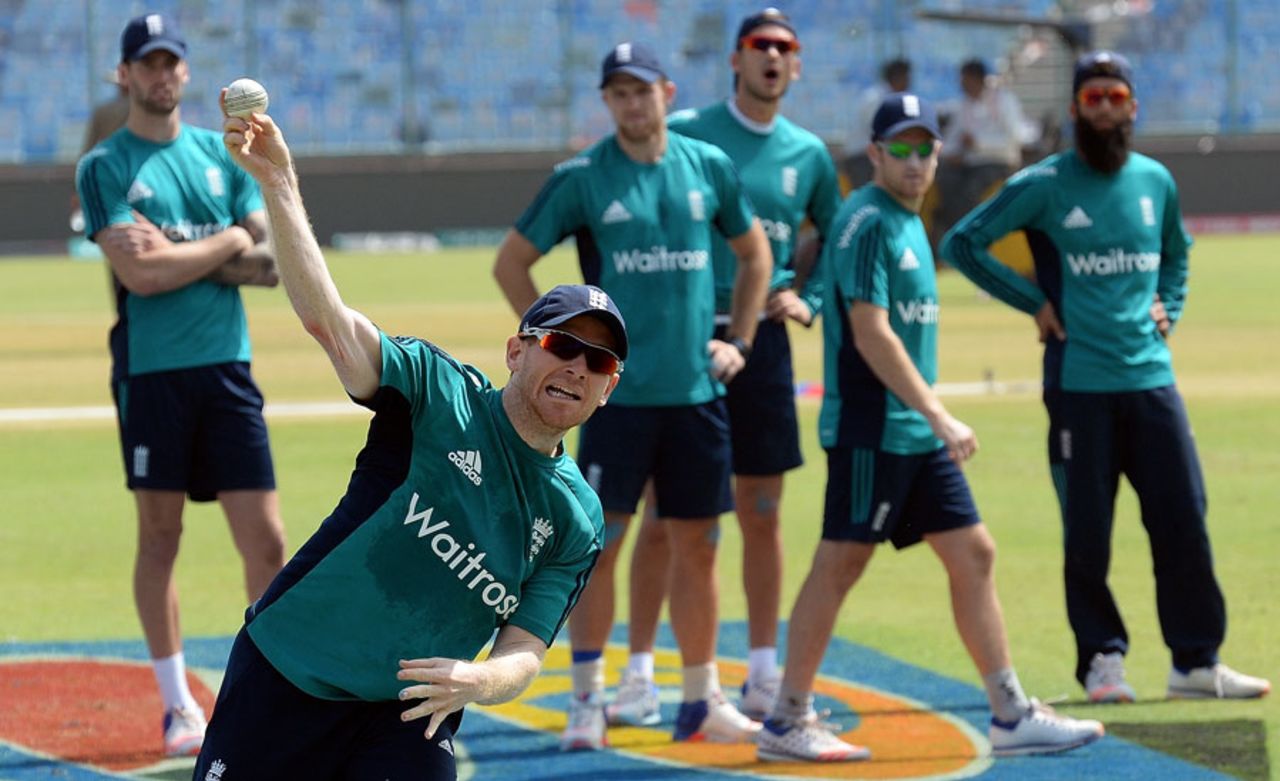 Eoin Morgan takes part in a fielding drill, watched by his team-mates, Delhi, March 29, 2016