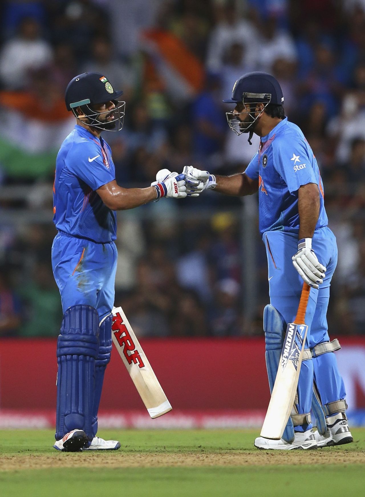 Virat Kohli and MS Dhoni touch gloves during their partnership, India v West Indies, World T20 2016, semi-final, Mumbai, March 31, 2016