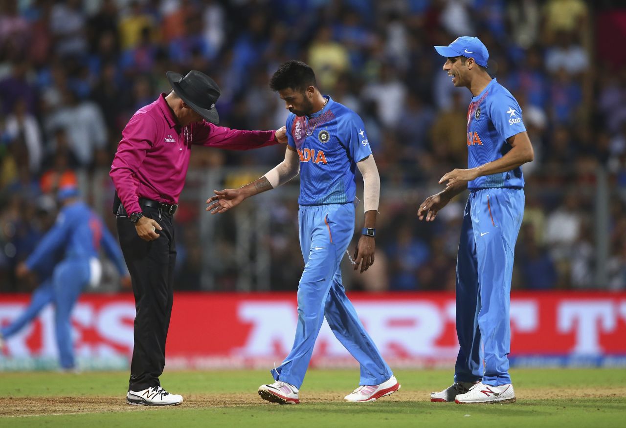 Hardik Pandya retrieves the ball from umpire Richard Kettleborough after the wicket of Lendl Simmons was nullified by a no-ball, India v West Indies, World T20 2016, semi-final, Mumbai, March 31, 2016