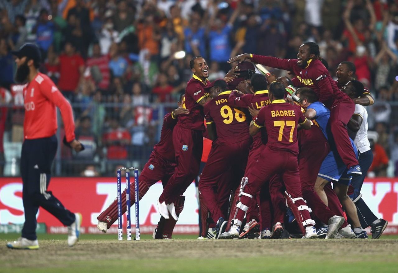 Chris Gayle leaps onto the West Indies players' huddle, England v West Indies, World T20, final, Kolkata, April 3, 2016 