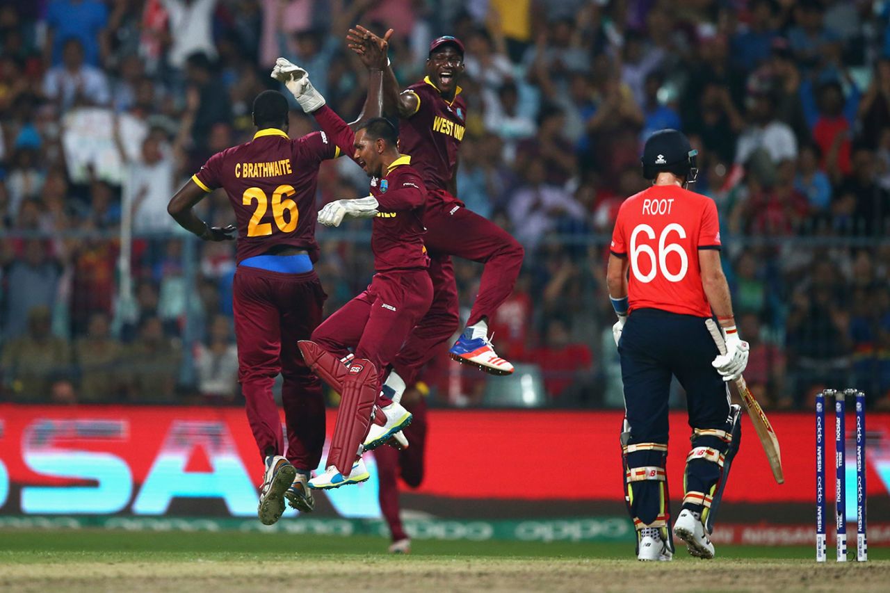 Carlos Brathwaite, Denesh Ramdin and Darren Sammy celebrate the wicket of Joe Root, England v West Indies, World T20, final, Kolkata, April 3, 2016 