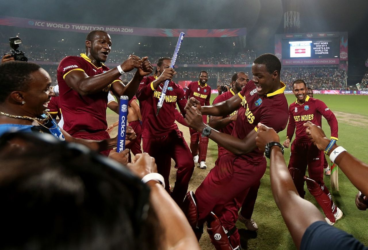 Darren Sammy and Carlos Brathwaite celebrate West Indies' win with the rest of the team, England v West Indies, World T20, final, Kolkata, April 3, 2016 