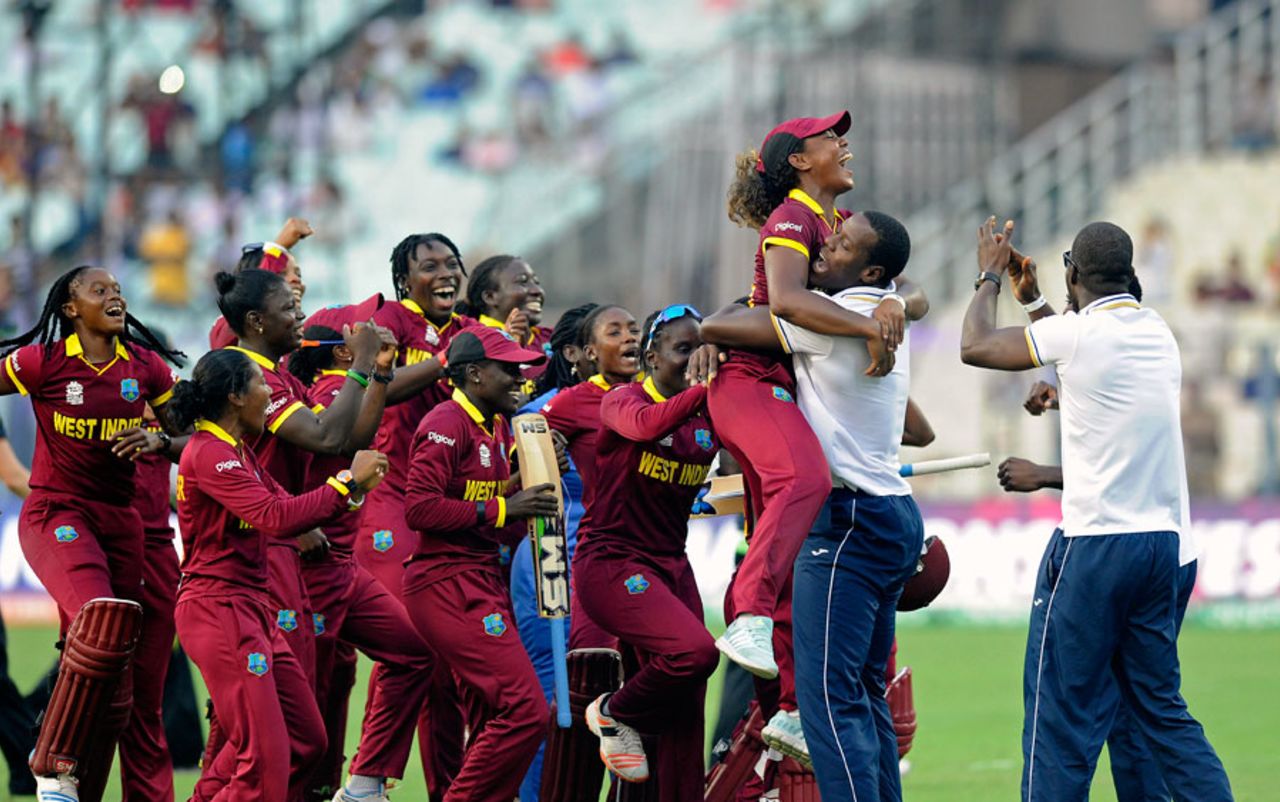 Carlos Brathwaite gives Hayley Matthews a hug as West Indies' teams celebrate the women's victory, Australia v West Indies, Women's World T20, final, Kolkata, April 3, 2016