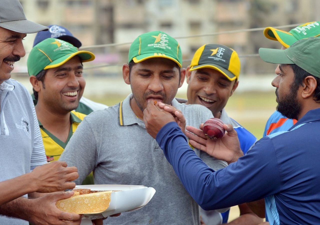 Sarfraz Ahmed is fed sweets after being named as Pakistan's T20I captain, Karachi, April 5, 2016
