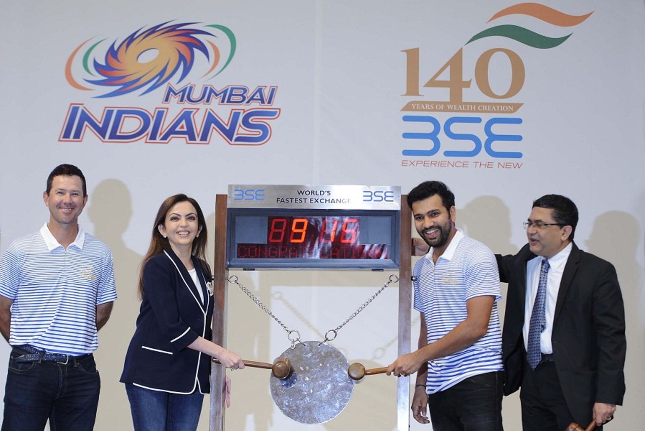 Mumbai Indians owner Nita Ambani and captain Rohit Sharma ring the opening bell at the Bombay Stock Exchange, while Ricky Ponting looks on, Mumbai, April 7, 2016