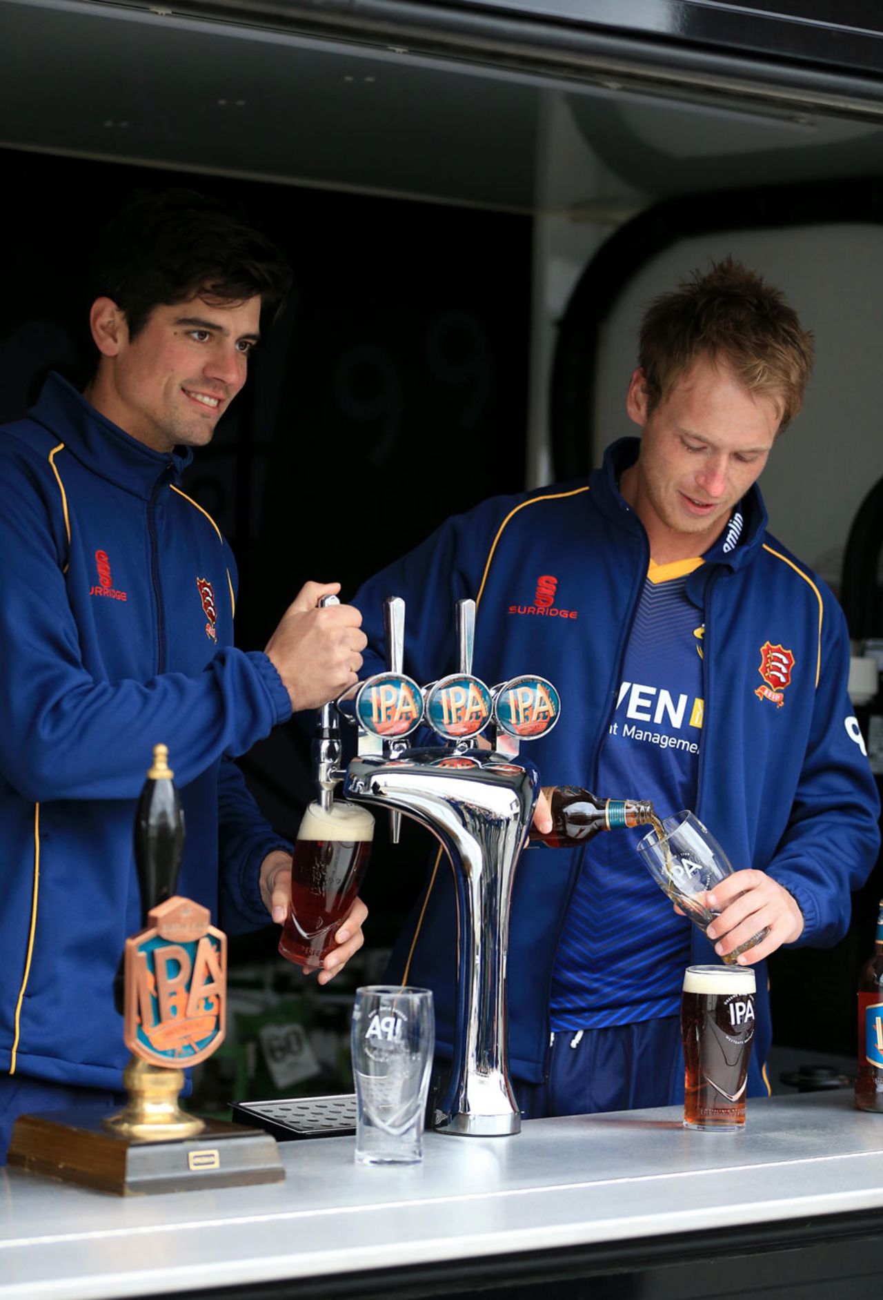 Alastair Cook and Tom Westley put in a shift behind the bar, Chelmsford, April 7, 2016