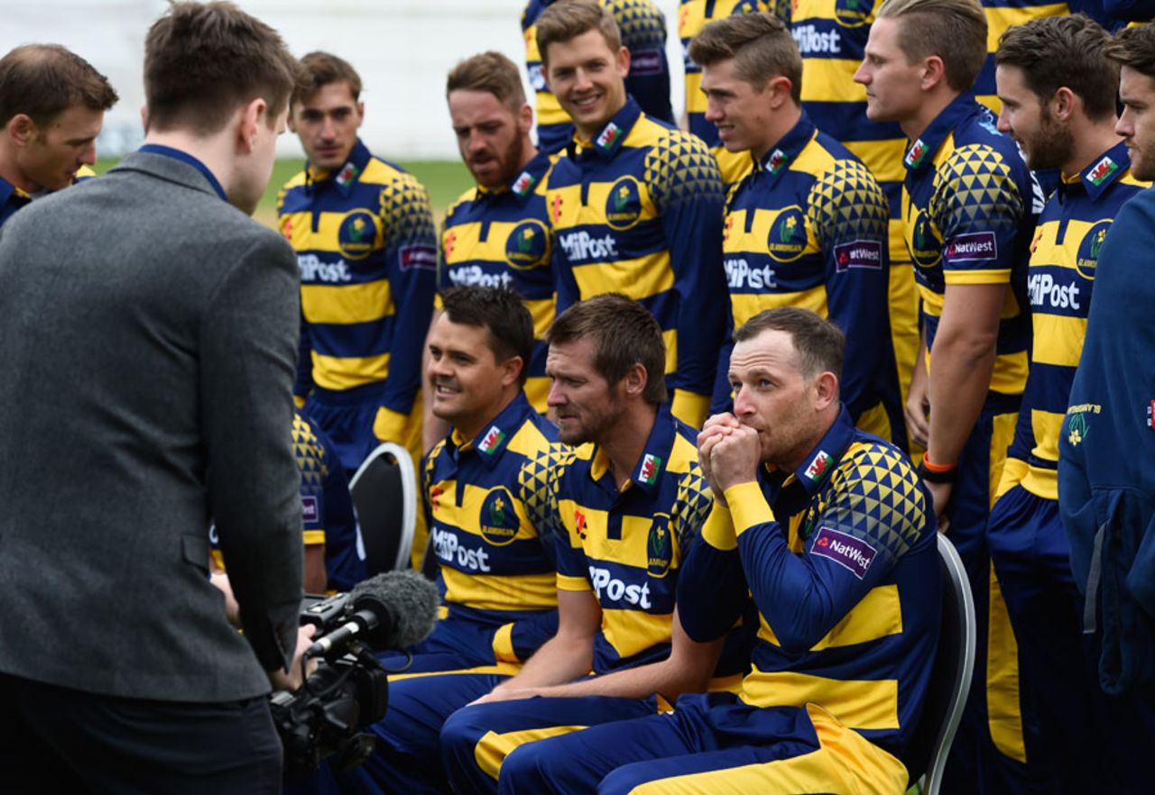 Graham Wagg warms his hands during a Glamorgan team shoot, Cardiff, April 7, 2016